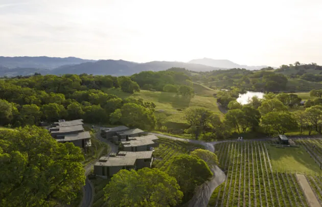 Aerial view over the grand lawn and guest rooms looking out at Mount St. Helena.