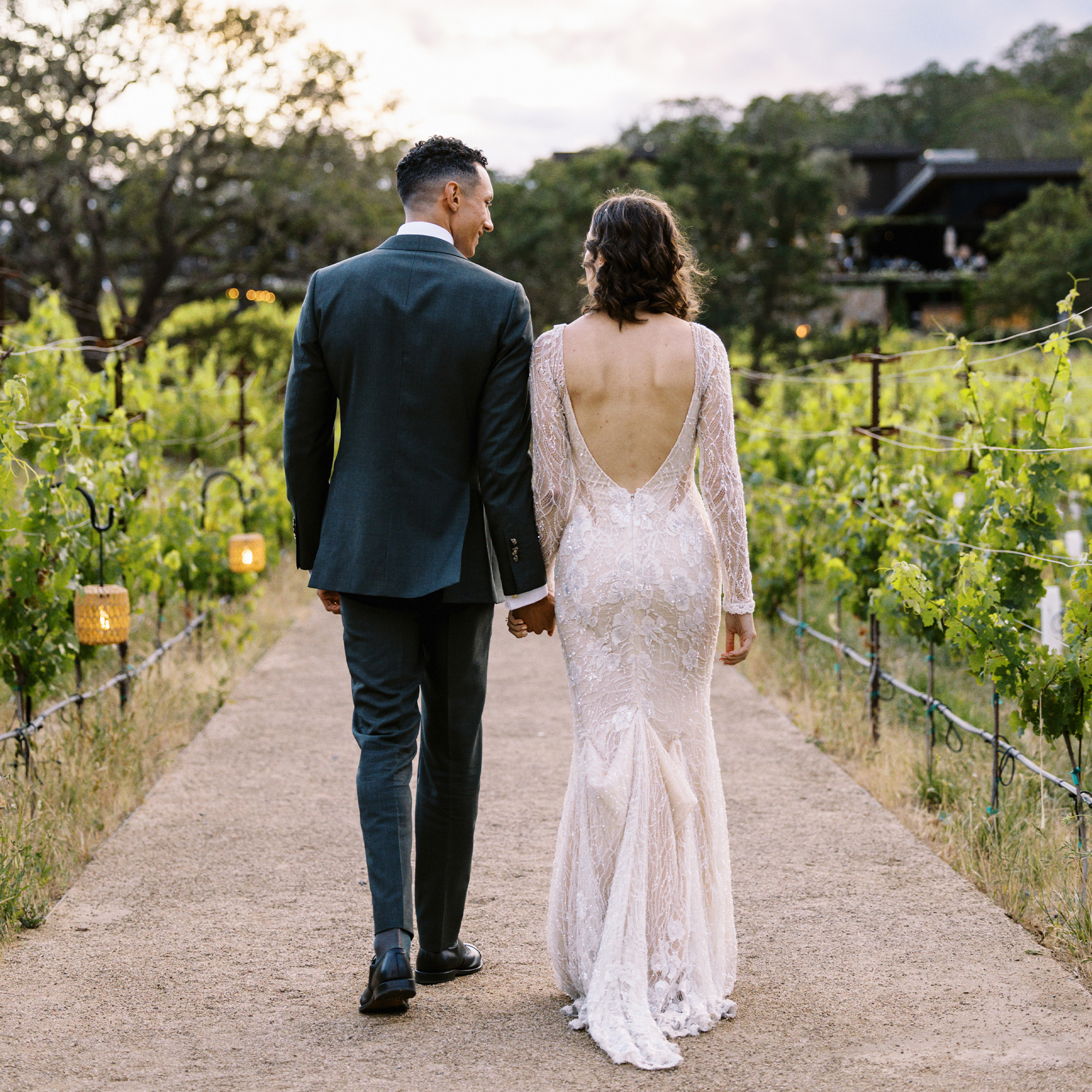 Couple walking amongst the vineyard at Healdsburg wedding