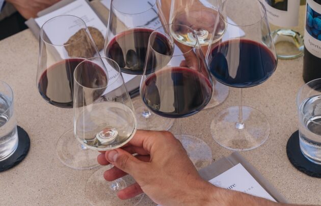 Wine tasting setup with glasses and bottles on a table