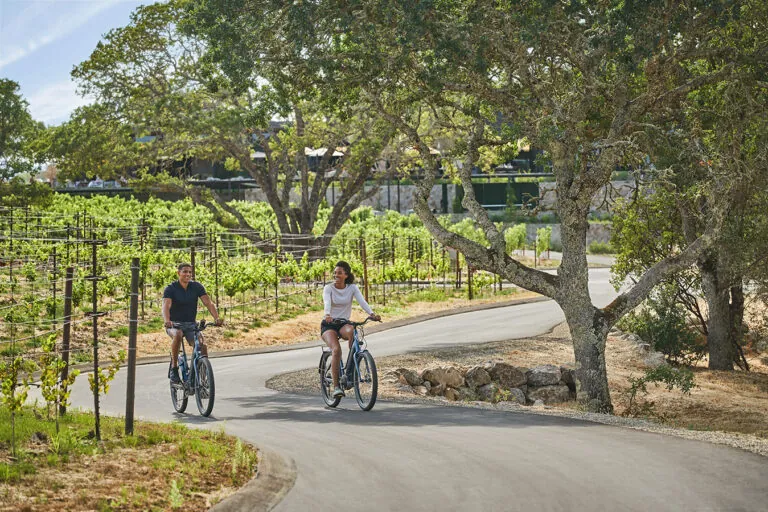 A couple riding bikes in Montage Healdsburg