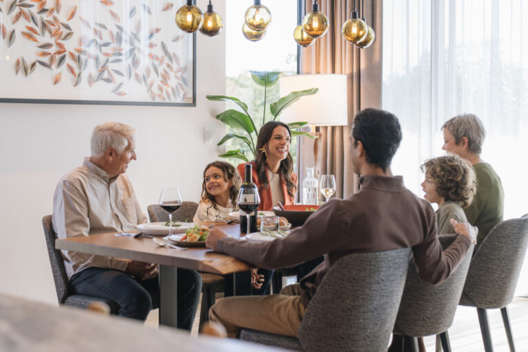 A family gathered around the dining table.