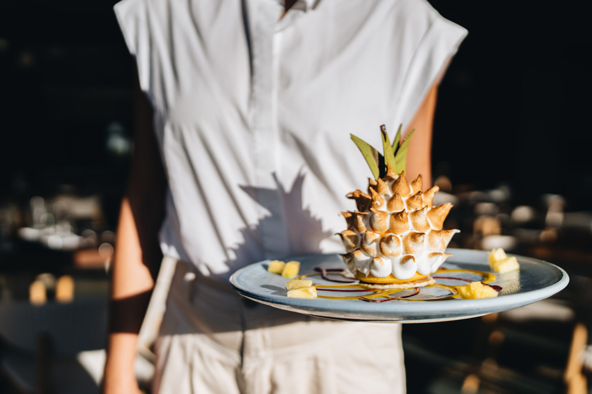 Woman holding Baked Hawaii dessert.