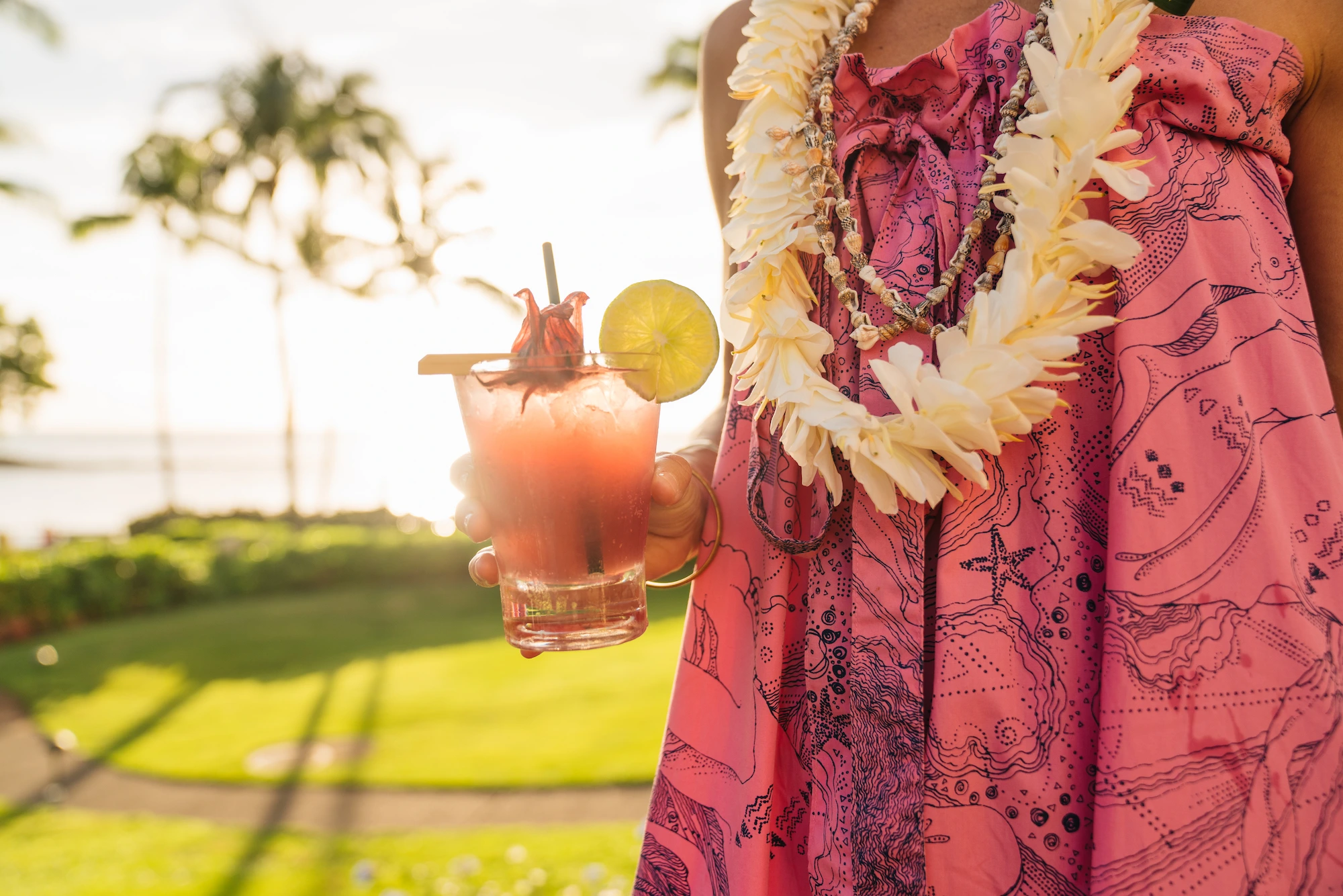 Girl sipping a cocktail at Montage Kapalua Bay