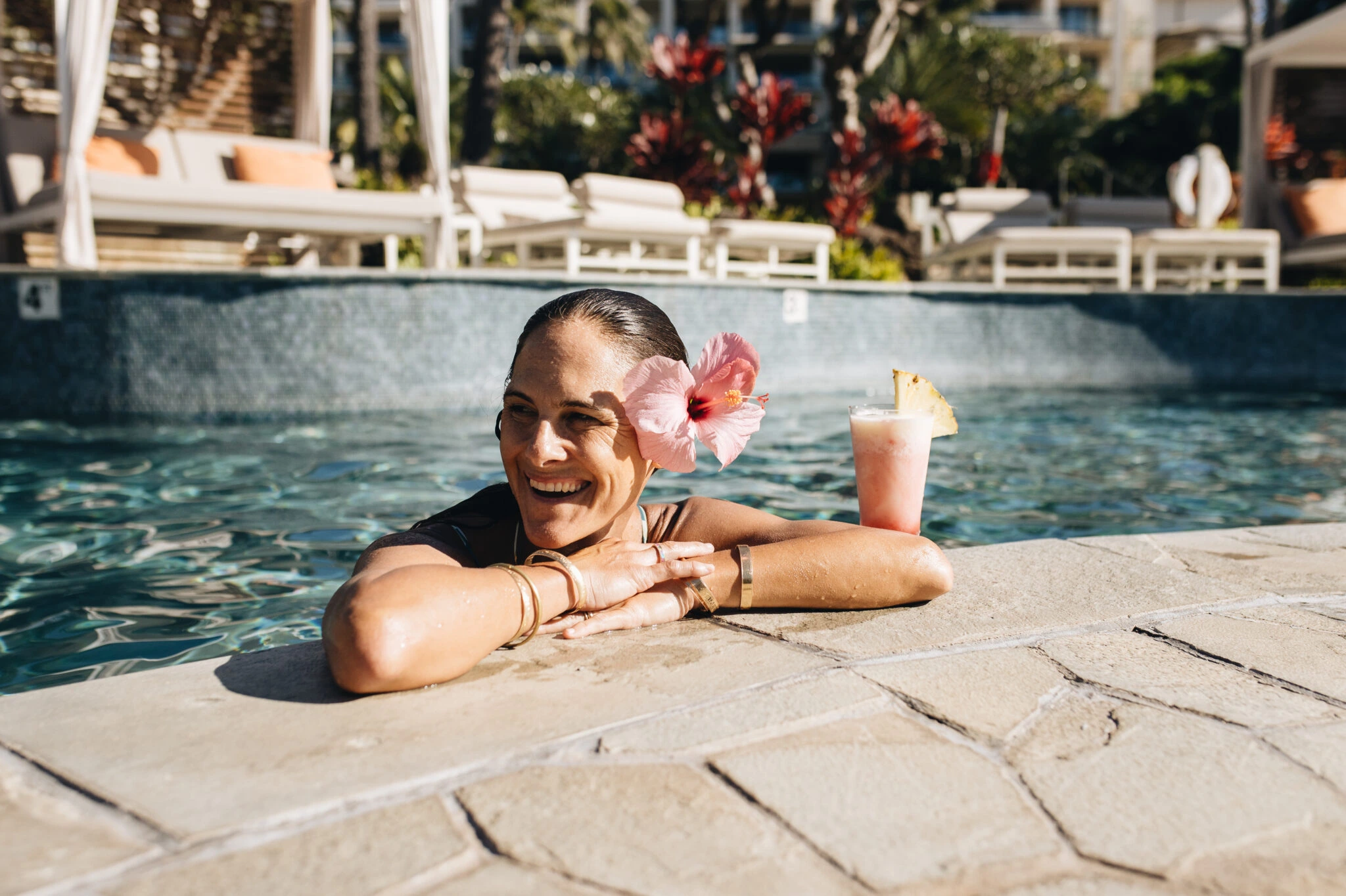 A woman at the Pool Deck at Montage Kapalua Bay