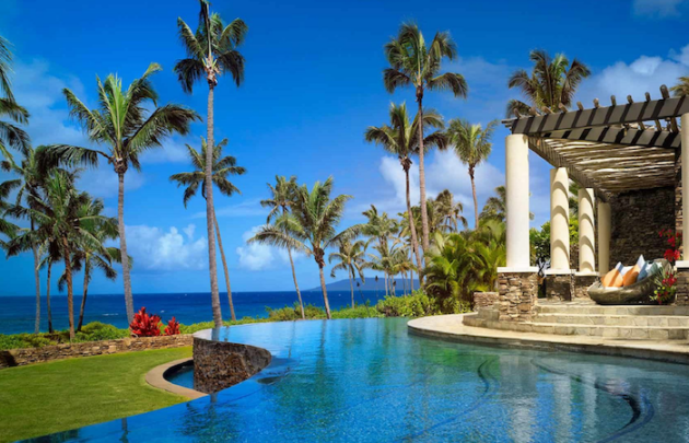 Infinity pool overlooking palm trees