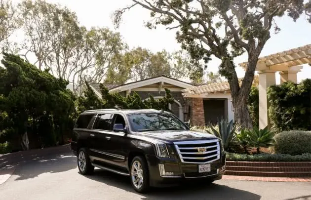 Black SUV parked outside of building