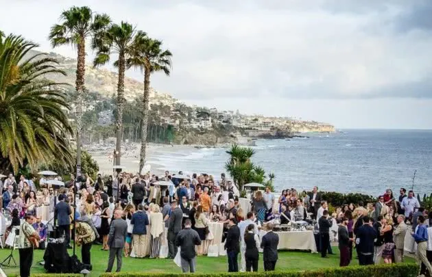 Large group of people outside with live music for an event