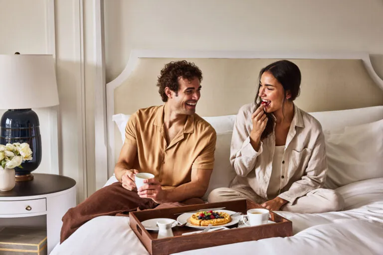 Couple enjoying breakfast in a suite at Montage Laguna Beach.