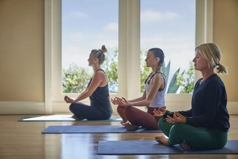 Women practicing yoga and meditation at Montage Laguna Beach.
