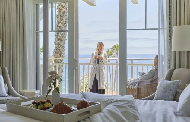 Couple Dining in their luxury guest suite at Montage Laguna Beach