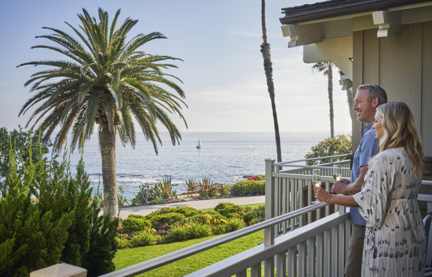 Couple overlooking ocean views on Montage Laguna Beach balcony