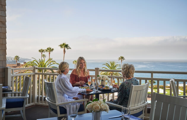 Ladies eating lunch on patio at The Loft