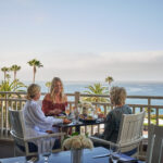 Ladies eating lunch on patio at The Loft