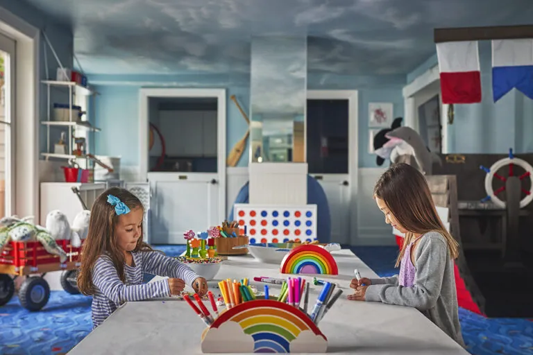 Two children doing arts and crafts at Paintbox