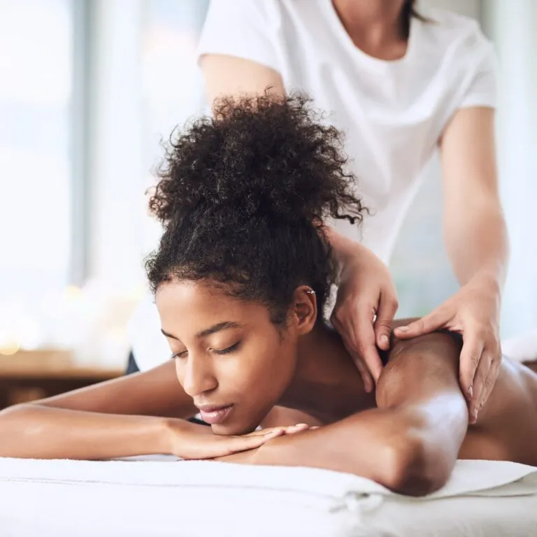 Shot of a young woman getting a massage at a spa