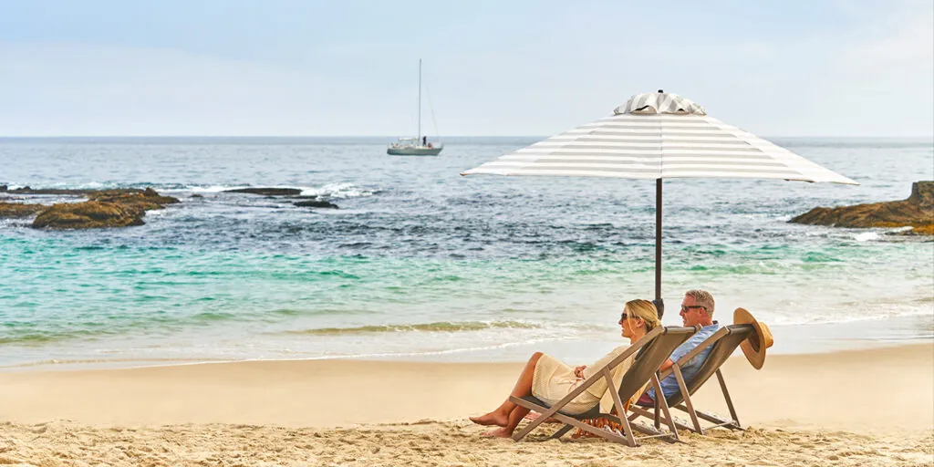 A couple on the beach at Montage Laguna Beach
