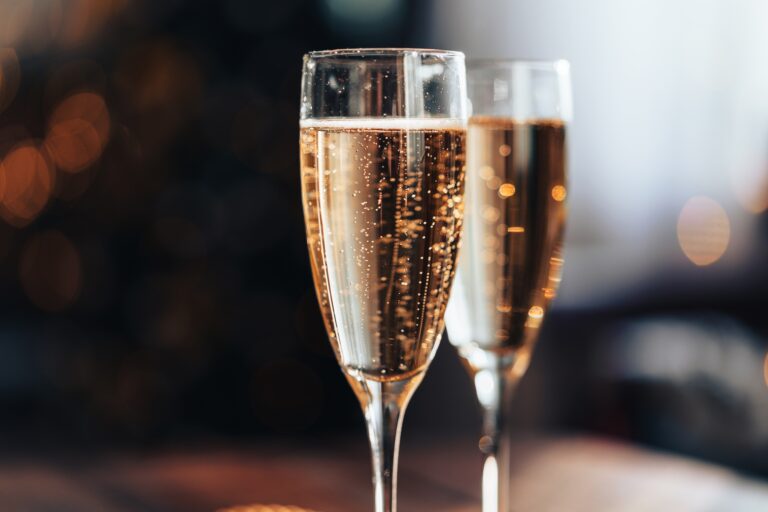 Close-up of champagne flutes with sparkling wine.