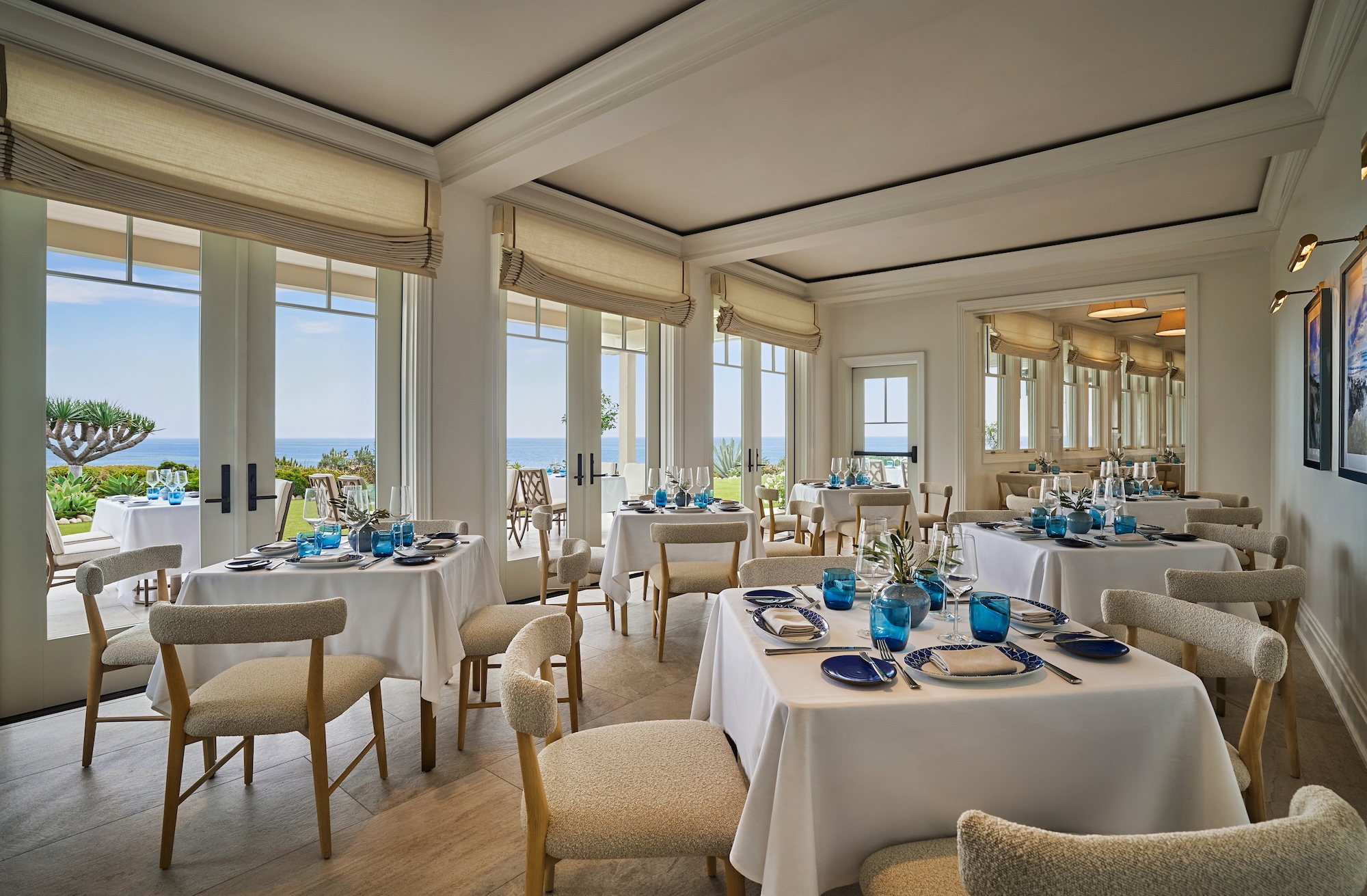 table set with glasses and flowers