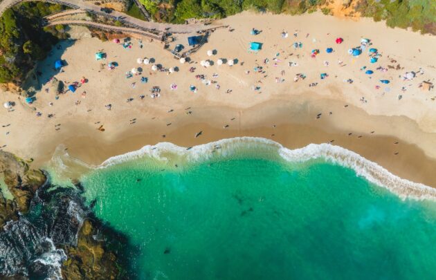 Aerial view of a beach with turquoise waves