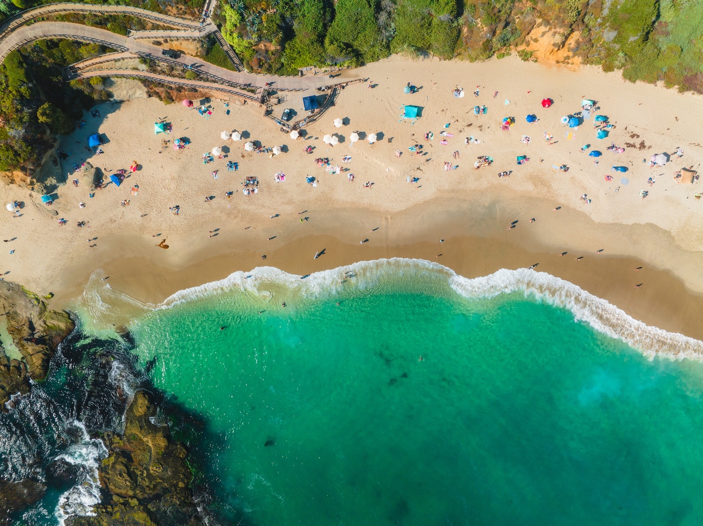 Aerial view of a beach with turquoise waves