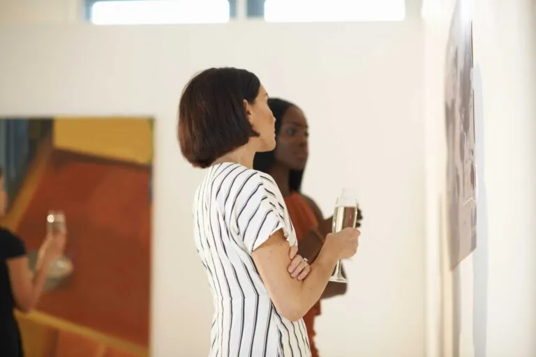 Two women at an art gallery