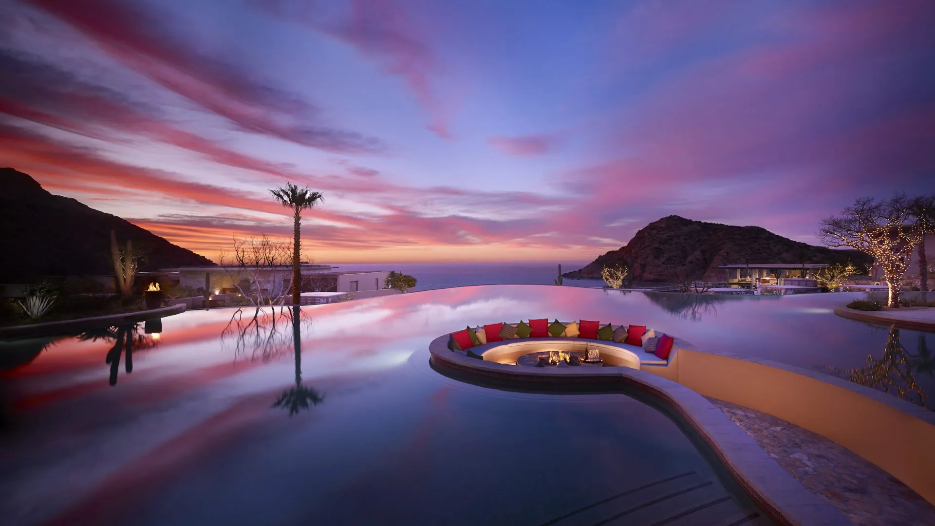 Firepit in the middle of the pool at sunset