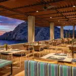 The outdoor patio of Marea at Montage Los Cabos at sunset
