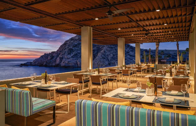 The outdoor patio of Marea at Montage Los Cabos at sunset