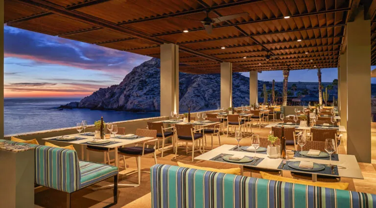 The outdoor patio of Marea at Montage Los Cabos at sunset