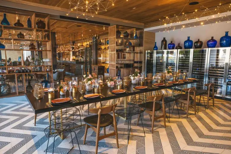 A dining room with a long table and chairs at Mezcal