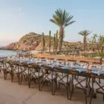 A table set up for a formal dinner at Marea by the ocean at Montage Los Cabos