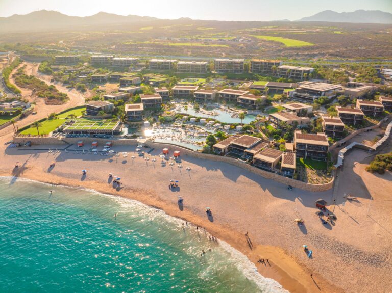 Aerial view of the resort from the beach at sunset