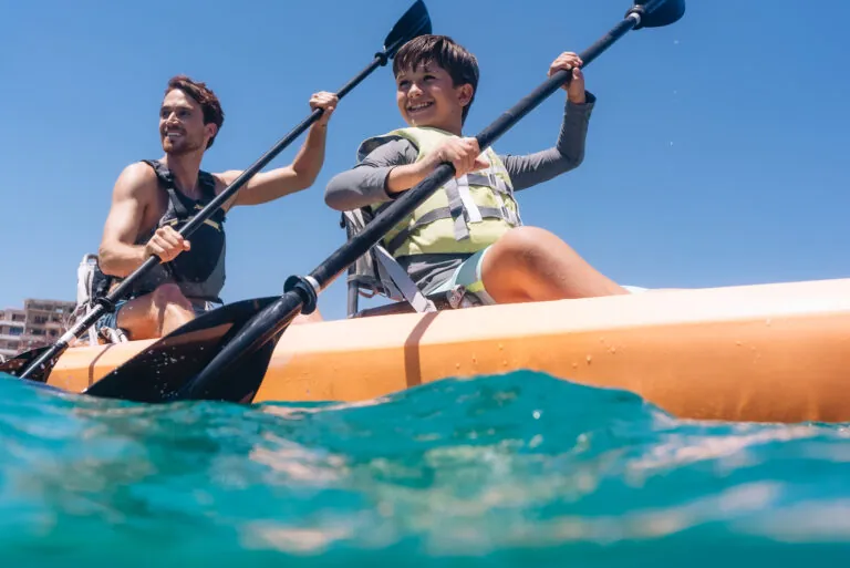 Father and son kayaking in Santa Maria Bay.