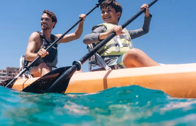Father and son kayaking in Santa Maria Bay.
