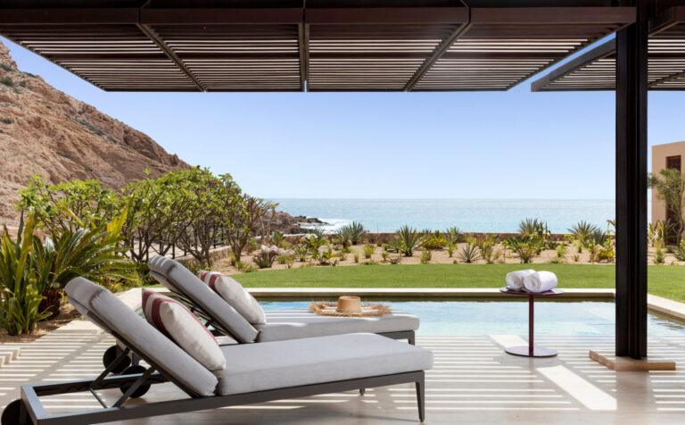 Plunge pool with two pool chaises next to it