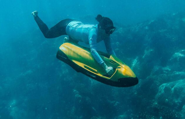 A woman swimming under water