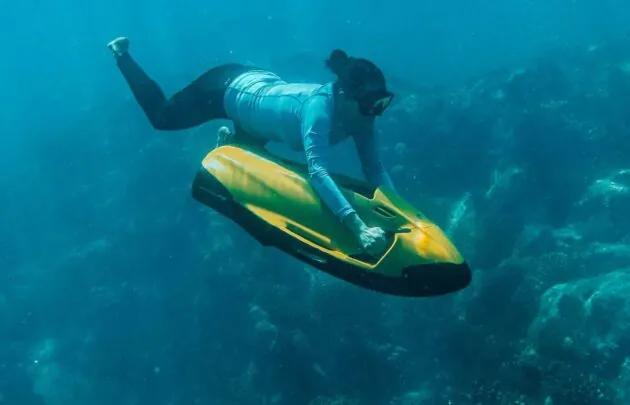 A woman swimming under water