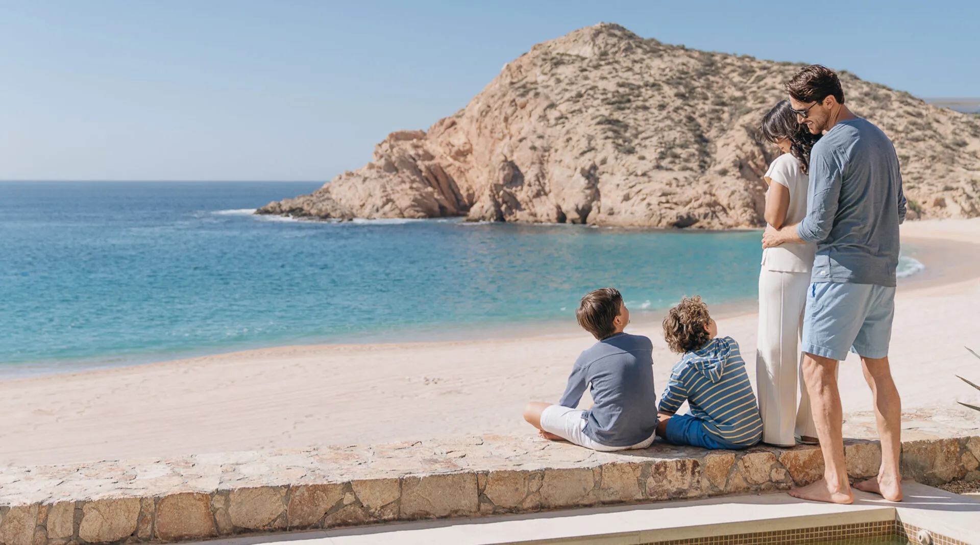 A family looking out on the beach at Montage Los Cabos