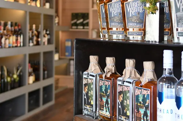 Bottles of Bourbon on a shelf.