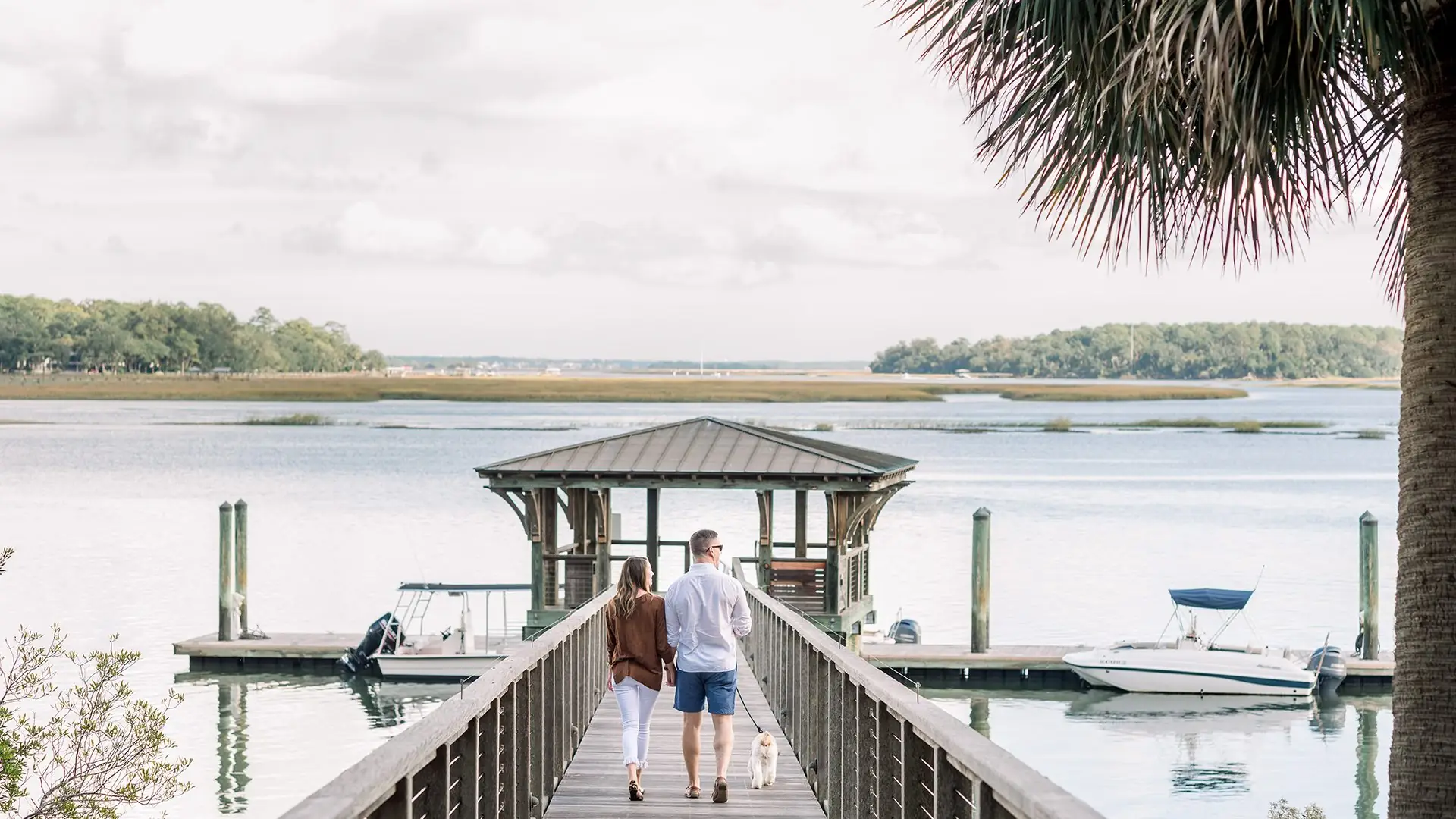 Couple walking on a pier