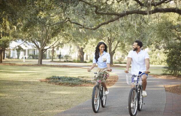 Couple biking in Palmetto Bluff