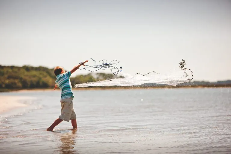 Boy playing on sandbar