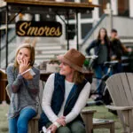 mother and daughter enjoying s'mores outdoors at Montage Palmetto Bluff
