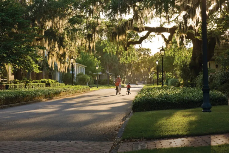 Green lush forests surrounding bikers near Montage Palmetto Bluff in the Lowcountry.