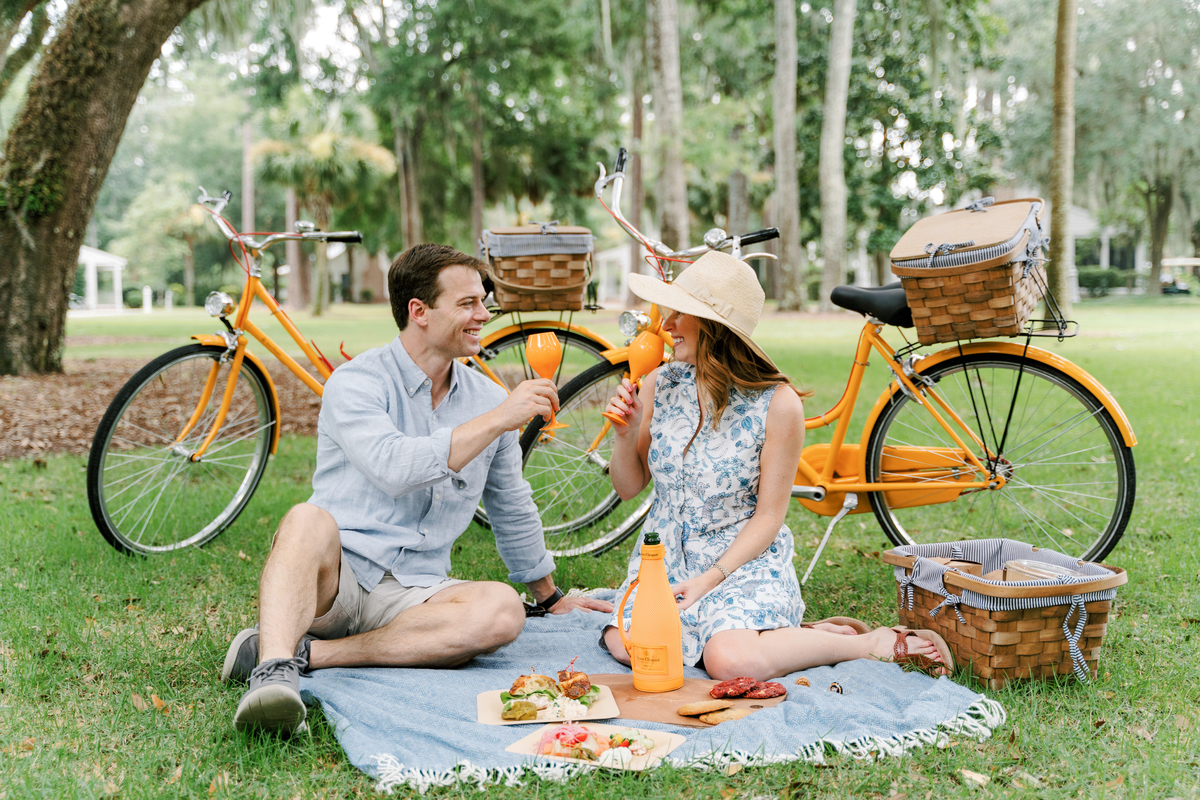 Couple Enjoying Champagne and a picnic at Montage Palmetto Bluff