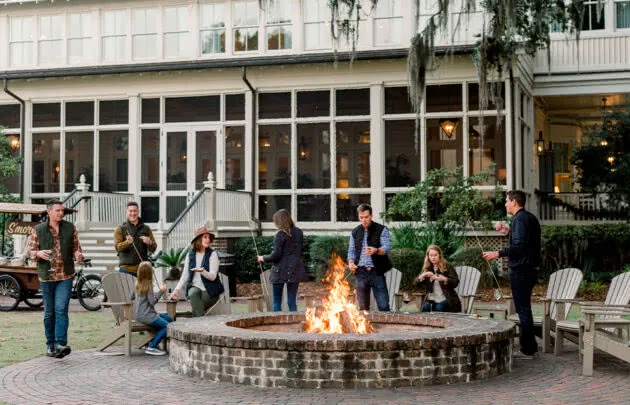 People roasting s'mores outside at Montage Plametto Bluff
