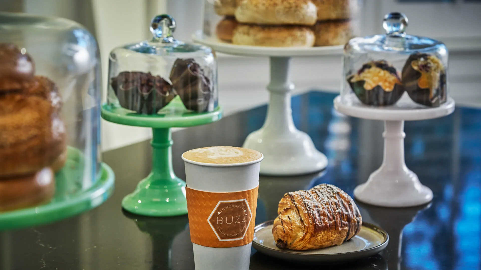 Coffee cup and scone on a table