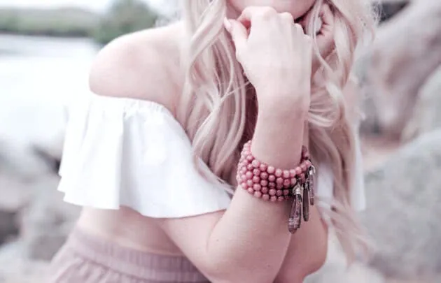 A woman wearing Melis Jewlery