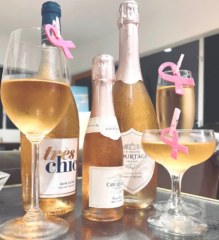 Champagne bottles and glasses on a glass table