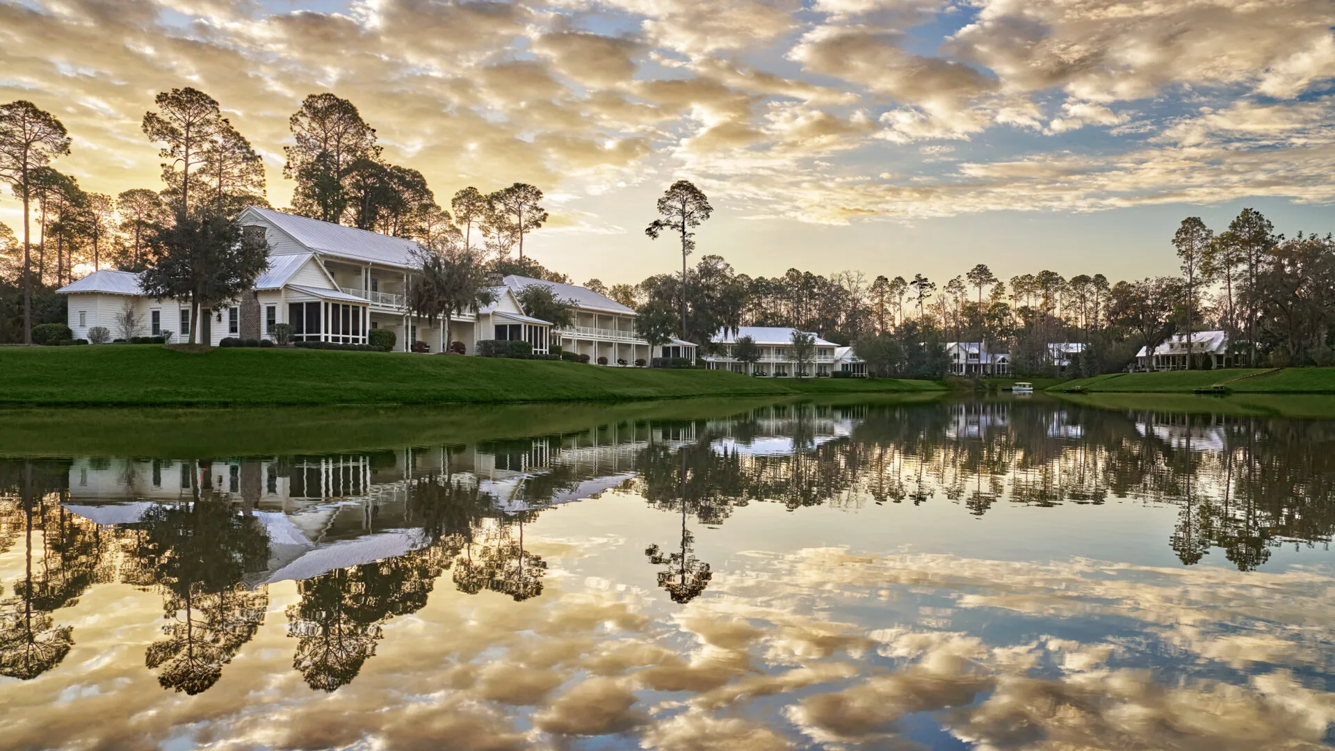 Guest Houses overlooking water with clouds above